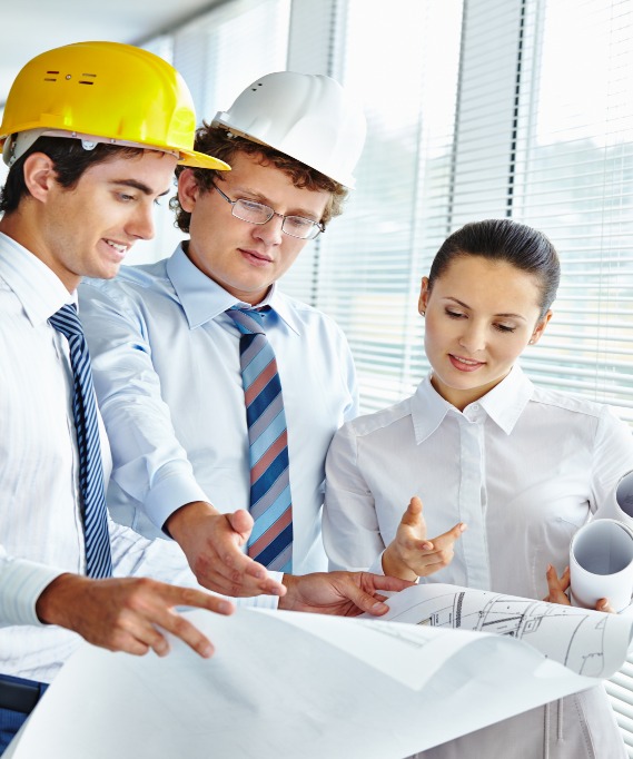 Three architects discussing sketch of new project